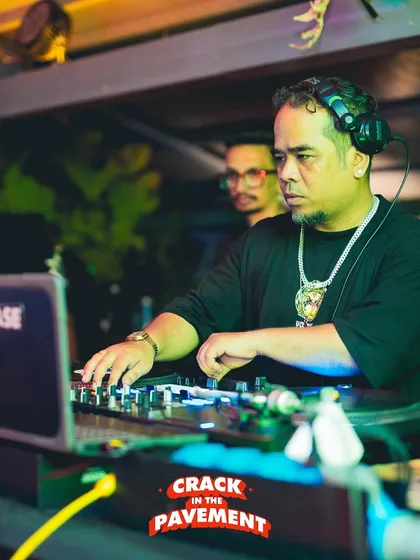 In the zone at a live gig. Being a professional DJ isn't just about playing music; it's about reading the room and controlling the energy. I bring years of real-world club experience to every lesson I teach.