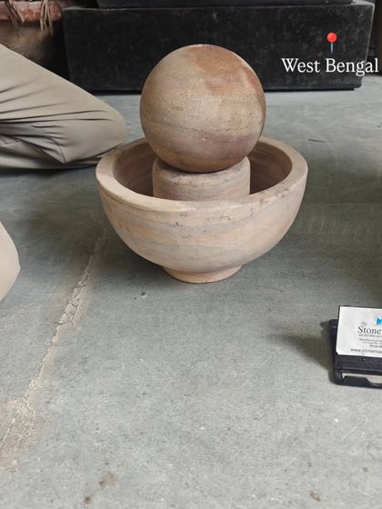 This small tabletop sphere fountain is carved from Rainbow Sandstone. It's shown here before packing for a client in West Bengal.