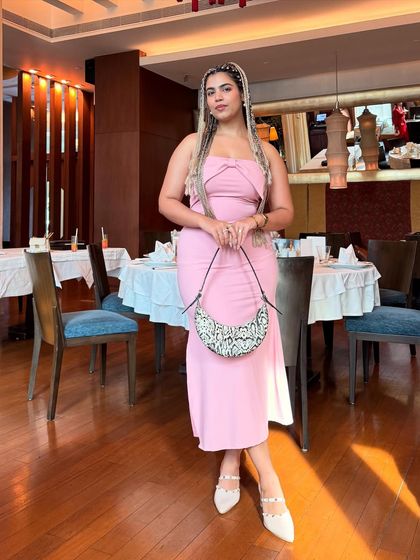 The full look with the pink dress and braids. I paired it with a statement bag and neutral heels.