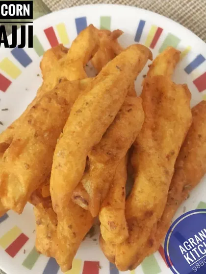 Crispy Baby Corn Bhajji, a delicious twist on the classic bhajji. The sweet baby corn pairs wonderfully with the savory, spiced batter, making it an irresistible snack.