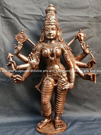 The wax model for a standing Durgai Amman. Her eight arms, which will hold various weapons, are clearly defined in this preliminary sculpture.