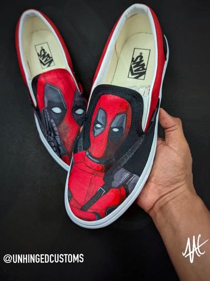 Another angle of the Deadpool slip-ons, showcasing the detailed artwork on the full canvas of the shoe.