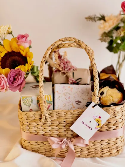 My Mother’s Day Basket is designed to make her feel cherished. It features a beautiful cone bouquet, blueberry muffins, lavender bon bons, assorted cookies, and a special jewelry box.