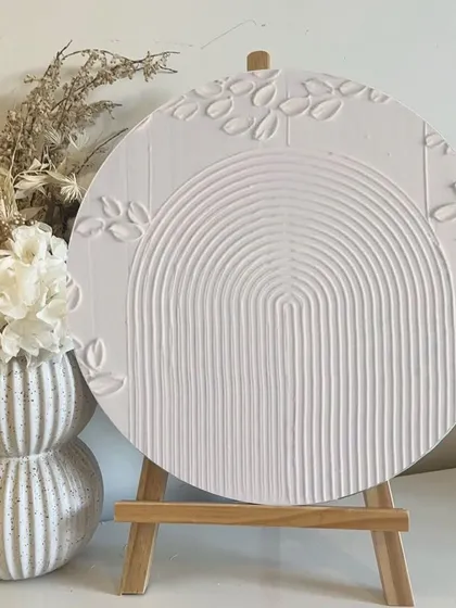 A beautifully finished textured arch artwork displayed on an easel. This minimalist and aesthetic piece is a popular project in my texture art workshops.