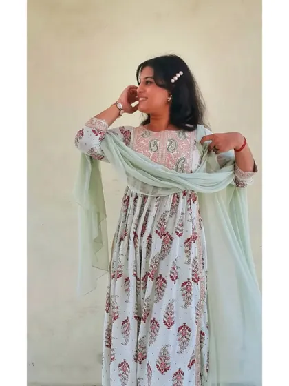 A playful shot showing the flow and embroidery detail of the Anarkali. This type of ethnic wear is perfect for family gatherings or when you want a comfortable yet elegant outfit.