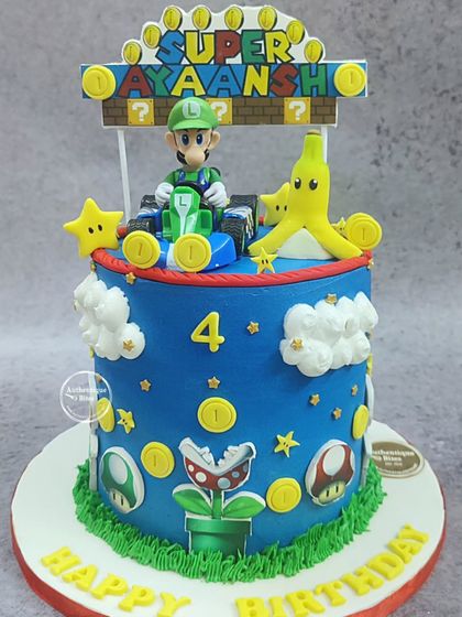 A Super Mario Bros cake that looks like it's straight out of the game. This non-fondant cake features Luigi in his kart, along with coins, mushrooms, and a piranha plant.