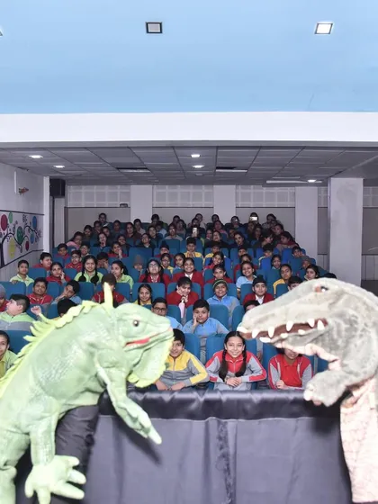 My giant reptile puppets made a big impression. Using large, expressive puppets helps capture the attention of even the biggest school auditoriums.
