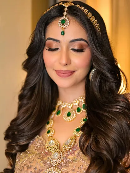 A close-up on the eyes, showcasing the soft, shimmery eyeshadow and defined brows that are key to this Heeramandi-inspired look.
