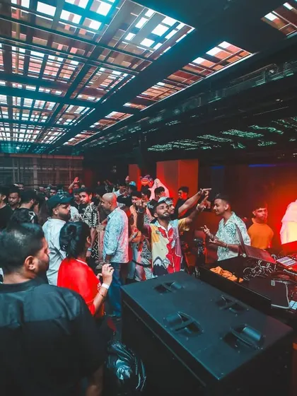 The view from the DJ booth during a wild Halloween party. You can even see a ghost decoration near the stage. The energy was unreal.
