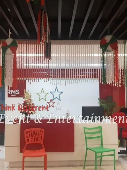 This is a reception area I decorated for Independence Day. I used hanging floral strings and themed decor to create a festive look around the company's front desk.