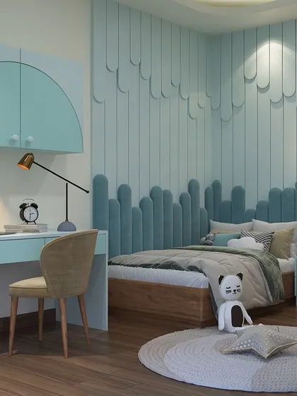 This modern kids' room in Ivy County, Noida, showcases a serene and sophisticated design. We used a soft teal palette, custom wall paneling with a wave-like texture, and a sleek study area to create a space that is both calming and conducive to creativity. The design is intended to grow with the child.