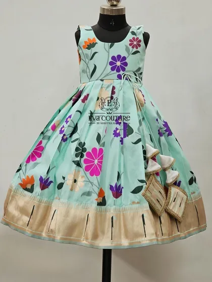 Another view of the sleeveless pastel blue floral frock.