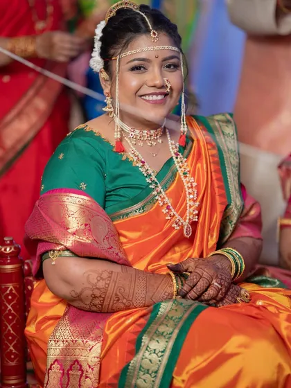 The final look for this bride's 'Kashibai' inspired Nauvari style. Her smile shows how happy she is with the result.