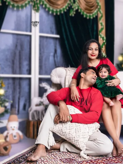 A candid moment of love and laughter, as a family enjoys their time together during their Christmas photoshoot.