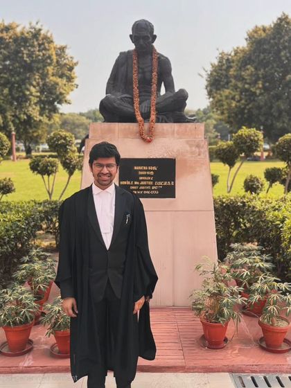 Standing before the statue of Mahatma Gandhi at the Supreme Court. His teachings on truth and justice are a constant source of faith and reverence, reminding me of the core principles of our legal system.