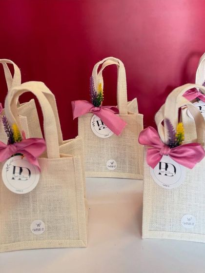 These custom jute thamboolam bags were designed to match a wedding's floral theme. They are elegant, thoughtful, and completely reusable, which is a detail I always love to include.