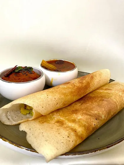The classic Masala Dosa, a favorite for any time of the day. I prepare it the traditional way, served with flavorful sambar and a fresh tomato chutney. It is simple, satisfying, and always reminds me of home.