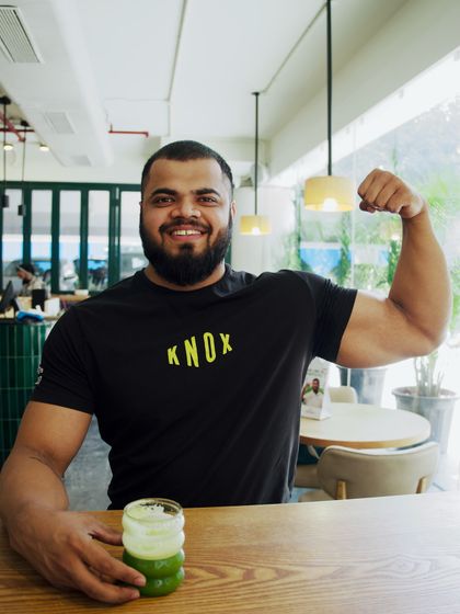 Coach Vinay enjoying a healthy green juice at our cafe after a training session. We believe in fueling the body with good nutrition.