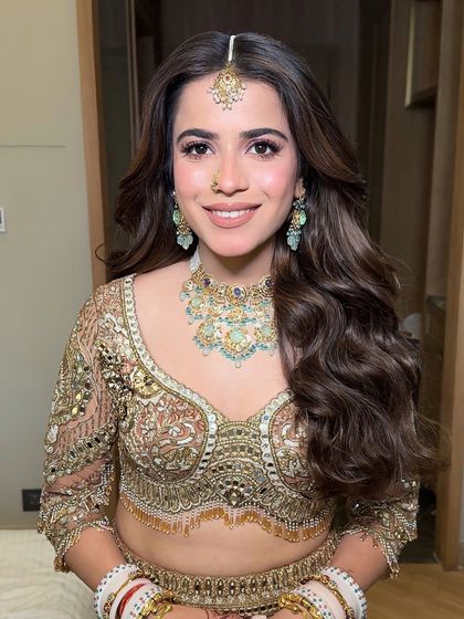 A close-up of the bride with her beautiful soft waves, a timeless and versatile choice that works for any wedding event.