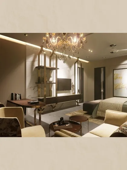 A multi-functional bedroom space that includes a seating area and a small work desk. I used a brass-finished open shelving unit as a subtle divider, adding a touch of glamour without closing off the space.