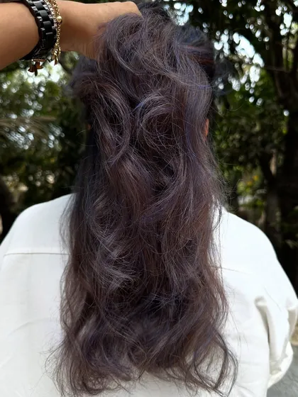 For my experimental clients like Bhakti, we love to play. This time we went for a cool purple and blue mix on her curly hair. The color looks so different after a few washes, fading into a beautiful pastel tone.