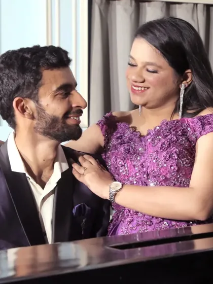 A candid moment from a pre-wedding shoot. The makeup looks natural and radiant, allowing the couple's happy expressions to be the focus.