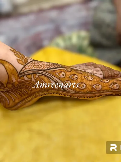 Another angle of the peacock foot design, highlighting the delicate line work.