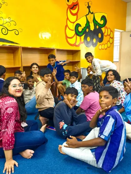 A happy group photo of children and volunteers after a fulfilling story session. These moments of shared joy and connection are what build our community and make our libraries feel like a second home.