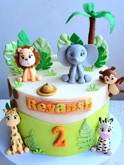 A closer view of the single-tier jungle animal cake, focusing on the cute, hand-sculpted characters.