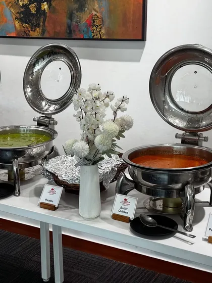 A glimpse of our professional buffet setup for a boardroom lunch at HDFC Life. We use high-quality chafing dishes to keep food like our Paneer Butter Masala and Green Thai Curry hot and fresh, ensuring a premium dining experience.