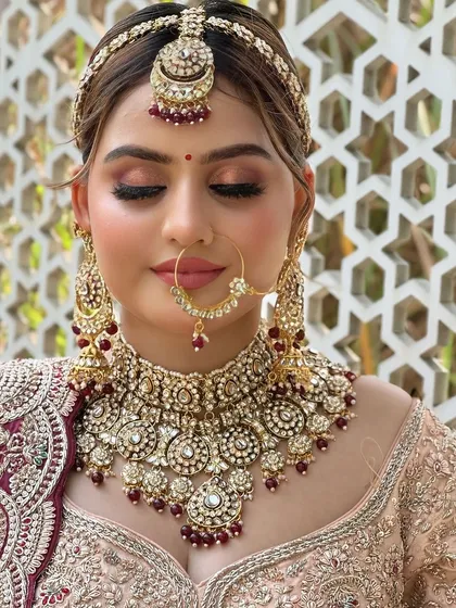 With her eyes closed, this shot emphasizes the beautifully blended eyeshadow and the soft, glowing finish of her skin.