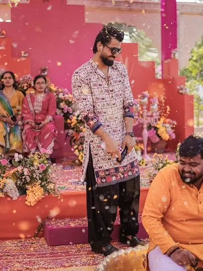 The fun of a Haldi ceremony is in the joyful mess. Here I am, getting caught in the crossfire of flower petals and fun.