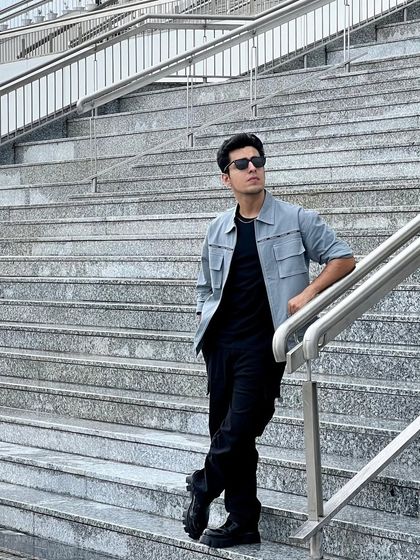 Another shot of Gagan Arora's event look, showing how the clean lines of the outfit work with the urban environment.