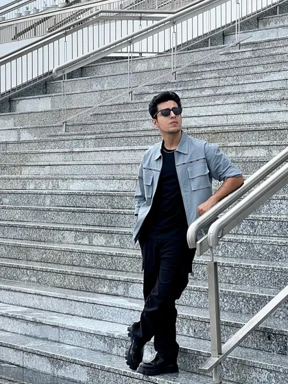 Another shot of Gagan Arora's event look, showing how the clean lines of the outfit work with the urban environment.