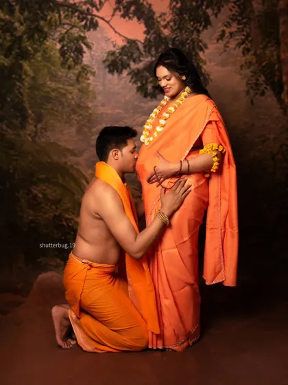 A pose of reverence and love from our Ram Sita series. The father-to-be kneels to kiss the baby bump, a beautiful gesture of anticipation and blessing for their child.