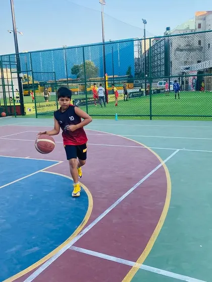 A young player drives to the basket, learning to attack the defense with confidence.