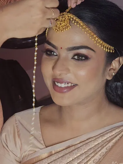 A happy moment during a bridal concept shoot. Even while pregnant, my passion for makeup kept me going, and I'm so proud of the results.