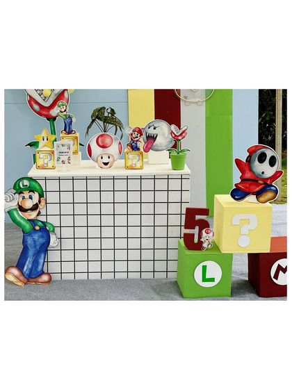 A closer look at the character props, including Luigi, Toad, and Shy Guy, set against a modern grid backdrop.