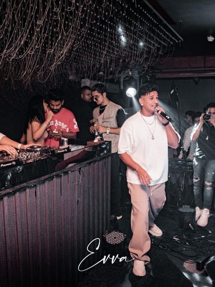 Here I am on the decks while Prince Narula performs for a packed house at EVVA. These events require seamless coordination and a deep understanding of performance flow.