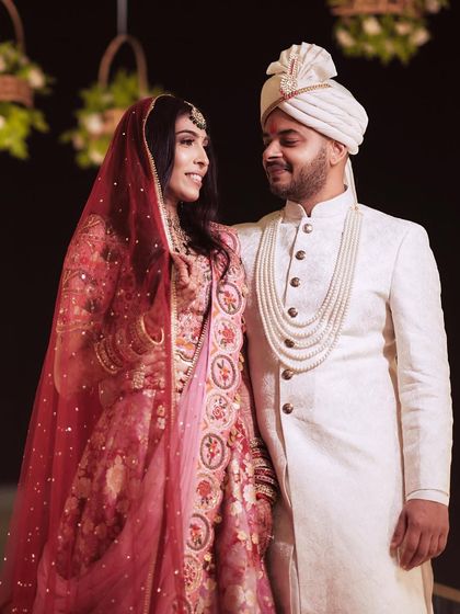 A sweet, candid moment between the newlyweds. Her makeup looks just as perfect up close.