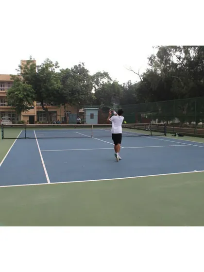 A view of a player preparing to hit a backhand during a training session on our well-maintained hard courts.