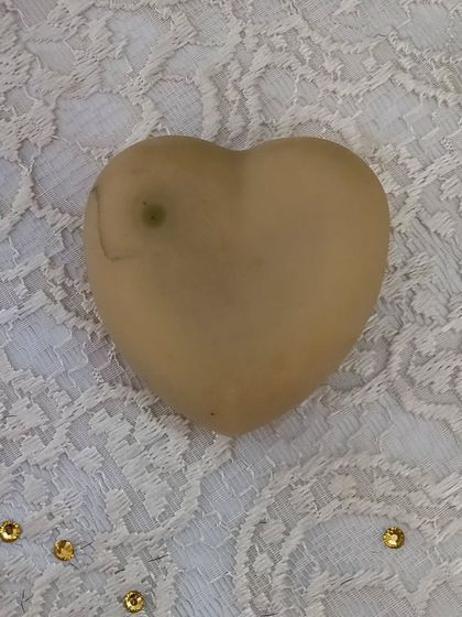 A close-up of a single 'Hope' soap. It’s a simple, beautiful bar that embodies my philosophy of conscious, natural skincare.