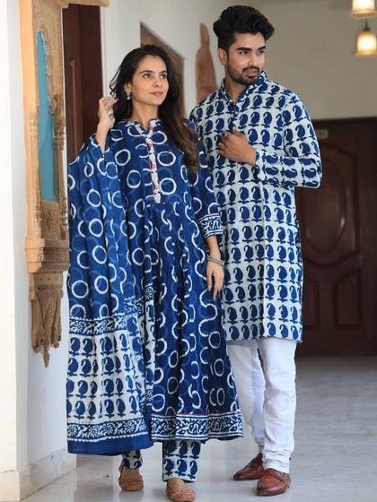 A bold indigo and white couple combo with large circular and paisley motifs. The woman's Anarkali comes with a full 2.5-meter pure cotton dupatta.