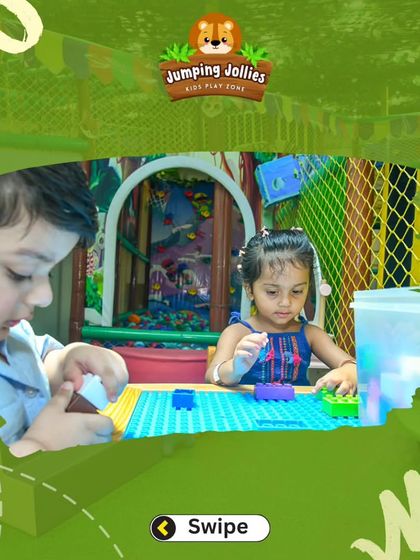 Teamwork makes the dream work. These two are collaborating on a building project with our interlocking block mat and colorful bricks.