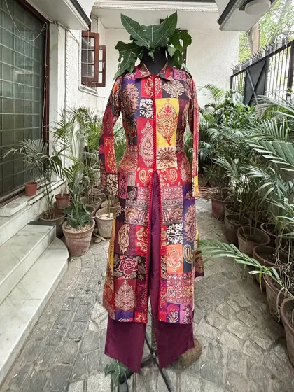 This style has a long, A-line front-open kurta with pants, creating a sleek and modern look.