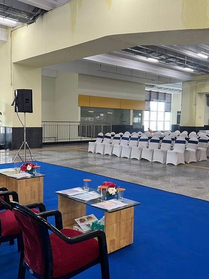 A wider view of the event setup inside the metro station, showcasing the blue carpet aisle and stage area. We can effectively convert public transit spaces into functional venues for corporate functions.
