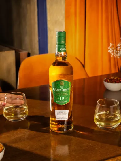 An on location lifestyle shoot for a premium whisky brand. We used the warm, ambient lighting of the bar to create a sophisticated and moody atmosphere, with a model's hand reaching for a glass to add a human touch.