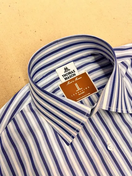 The collar of a custom shirt made with Thomas Mason fabric. Known for their exceptional quality, these fabrics result in shirts that are both durable and luxurious.