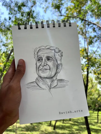 A photo of the finished Kuvempu sketch, a tribute to the literary giant.
