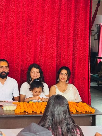 My family and I sit before the students at the closing ceremony. Our school is a family, and we share these important moments with our students.